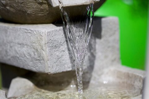 A close-up of running water in a water feature by Thrive Landscape Services