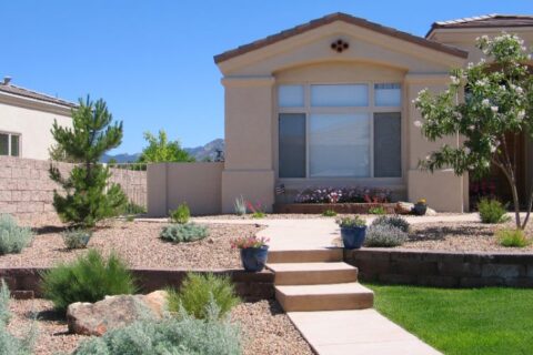 Xeriscaping in front of a house by Thrive Landscape Services