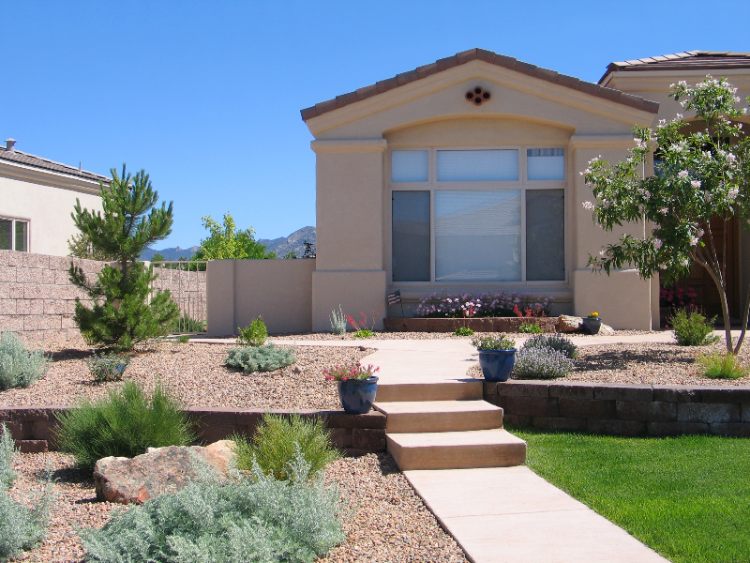 Xeriscaping in front of a house by Thrive Landscape Services